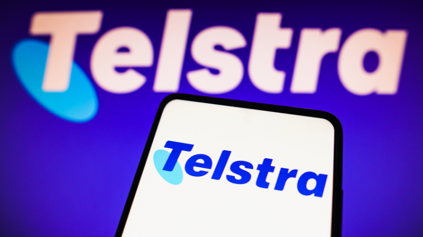 Telstra Corporation Limited logo seen displayed on a smartphone and in the background.