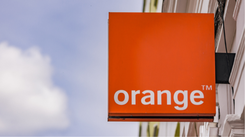 Orange mobile company logo hanging in exterior