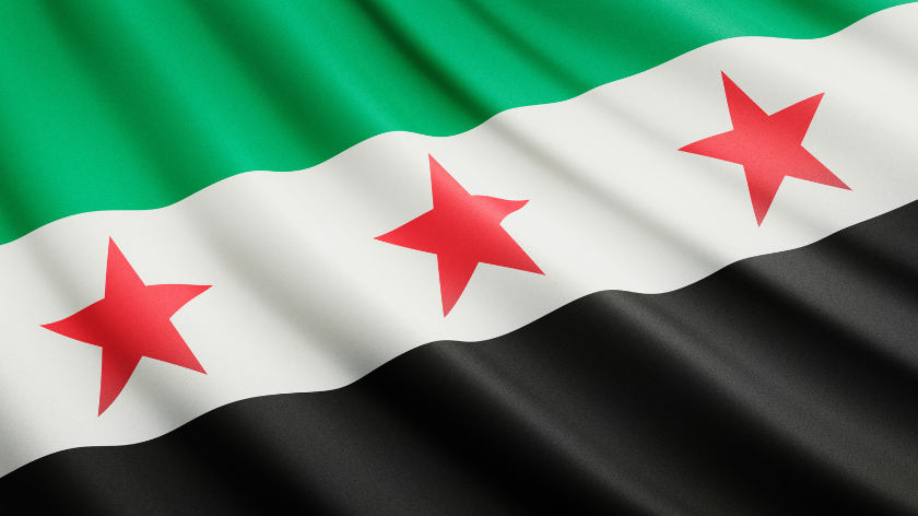 The new flag of Syria, featuring three red stars that represent the three main districts of Syria: Aleppo, Damascus and Deir el-Zor.