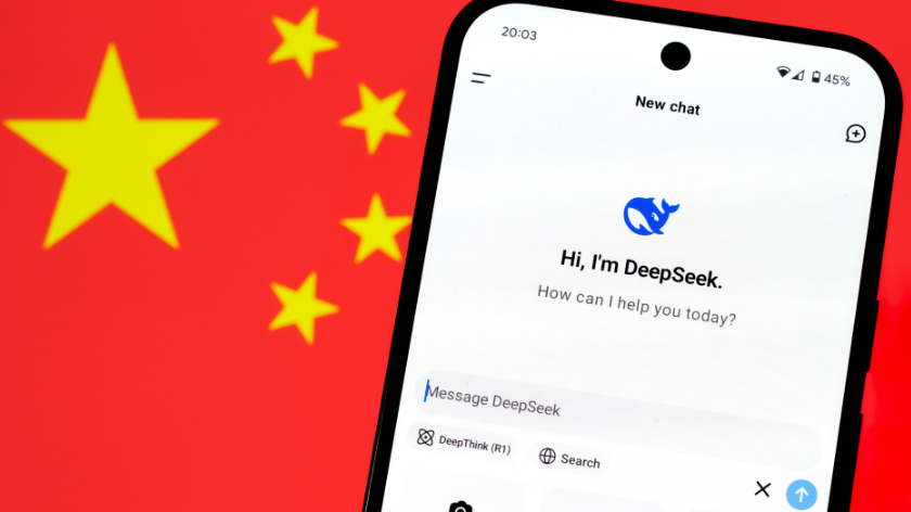 DeepSeek AI app chat seen on the smartphone and blurred Chinese flag on the background. Concept for a new chinese AI rival to ChatGPT