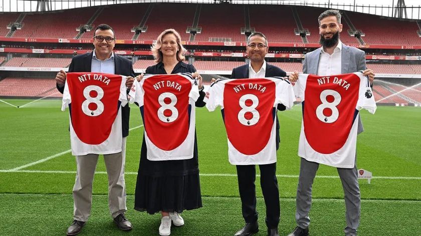 NTT Data and Aresenal staff unveiling their partnership at Emirates Stadium in London