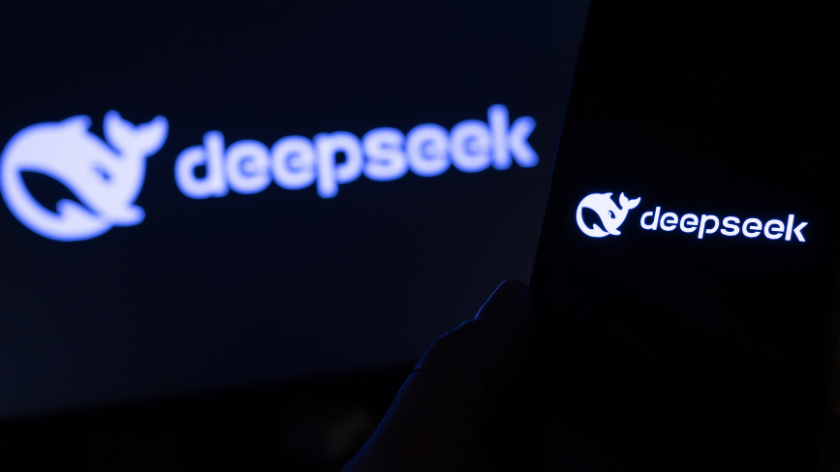 DeepSeek AI model displayed on a smartphone superimposed in front of a screen with the app logo blurred out