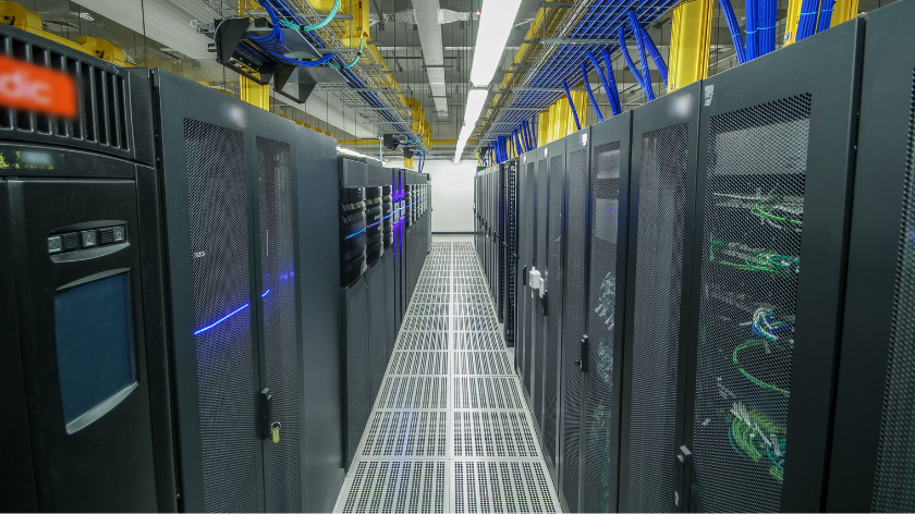 Generic data centre server room image: Room with rows of server hardware in data center 