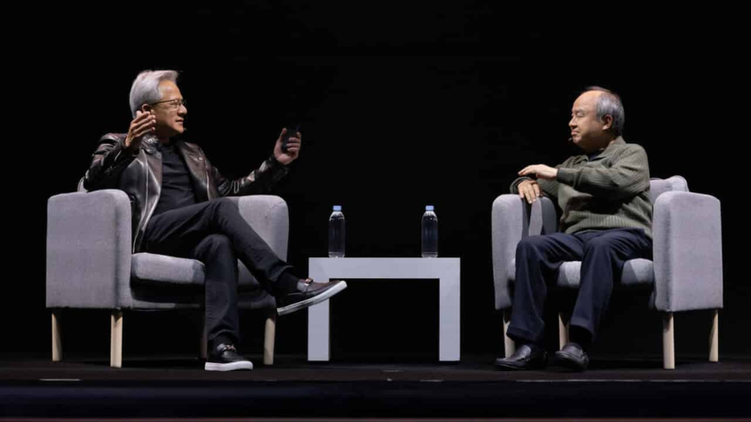 Nnvida founder and CEO Jensen Huang (left) and SoftBank chairm and CEO Masayoshi Son (right) on stage during Nvidia's AI Summit Japan keynote